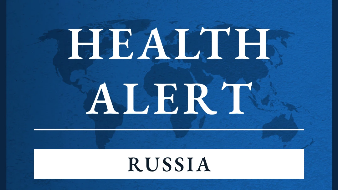 Прапор США на тлі повідомлень про карантинні заходи в Іркутській області